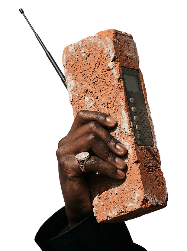 Hand holding a brick phone